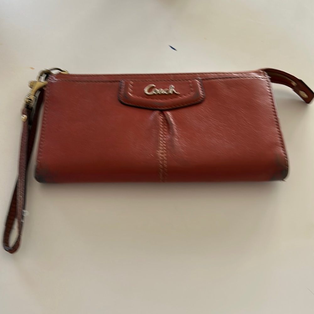 Brown leather coach wallet. 7 1/2 x 4, used.